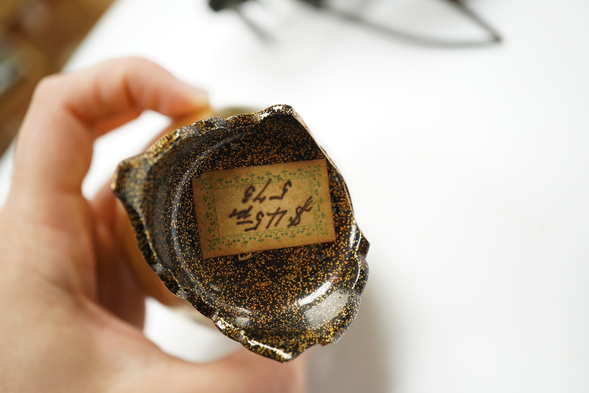 A damaged 19th century Japanese lacquer vase, a Japanese cloisonné enamel vase and a model tortoiseshell and lacquer rickshaw, rickshaw 20cm long., Condition - poor to fair